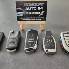 Clés de voiture de marques variées, dont BMW et Mercedes. Si votre neiman est bloqué, ces experts peuvent vous aider.