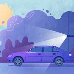 Une voiture violette est arrosée par un jet d'eau. Le soleil brille. Le tarif changement pompe à eau est peut-être abordé ici.