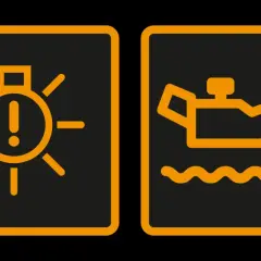 Voyant orange voiture : témoin d'alerte et niveau d'huile bas.