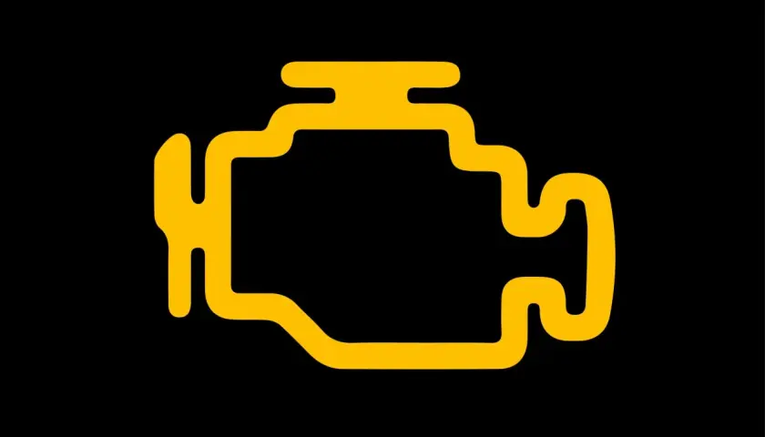 Voyant moteur orange allumé, signe d'un problème mécanique et d'une perte de puissance.